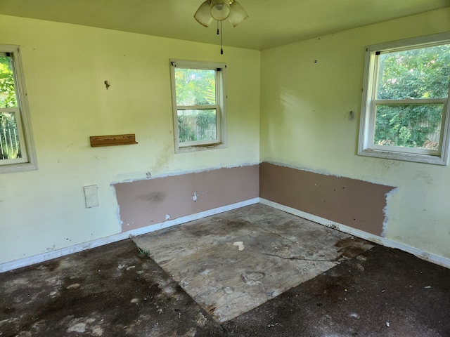 unfurnished room with ceiling fan