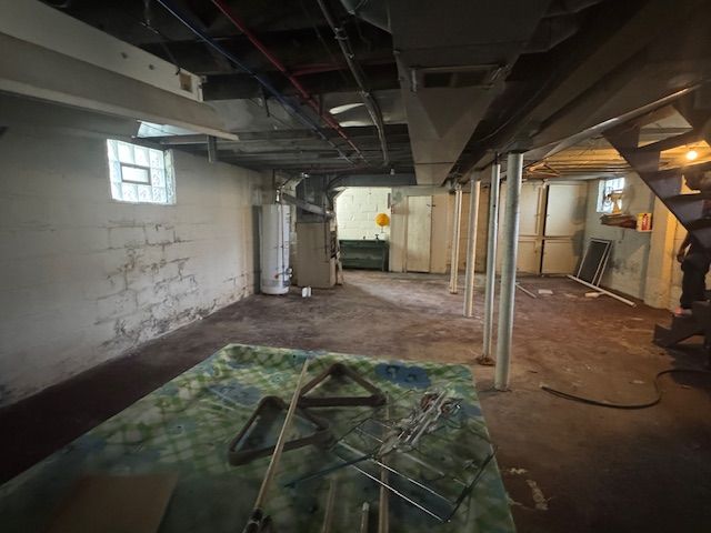 basement featuring water heater