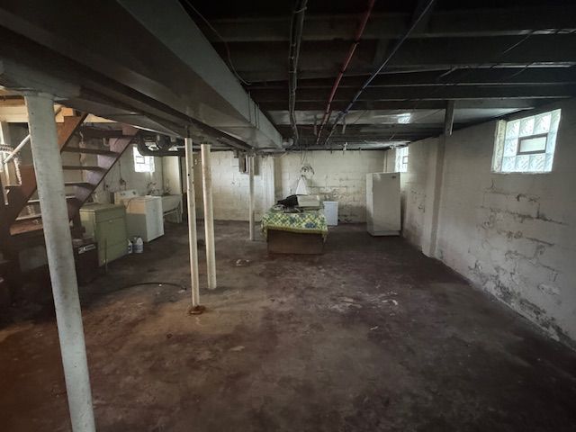 basement with washer and clothes dryer