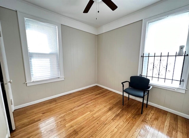 unfurnished room with ceiling fan, ornamental molding, and light hardwood / wood-style floors