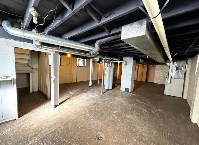 basement featuring water heater and heating unit