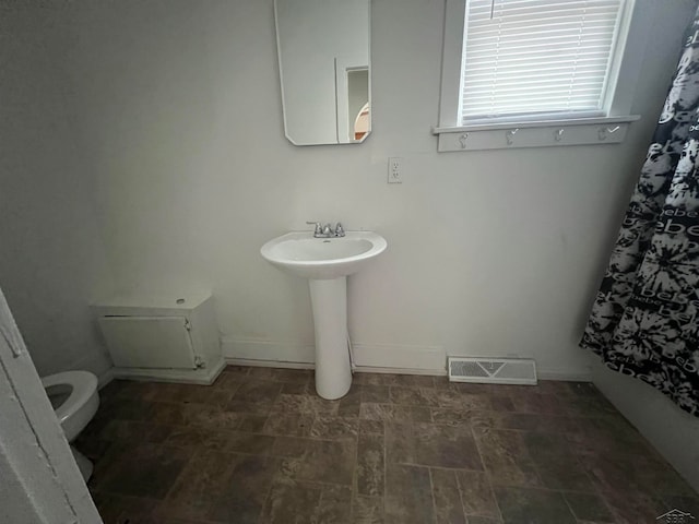 bathroom with toilet and sink