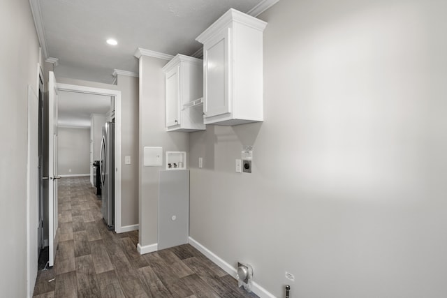 clothes washing area featuring electric dryer hookup, dark hardwood / wood-style flooring, ornamental molding, and hookup for a washing machine