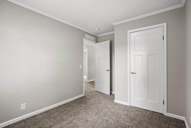 unfurnished bedroom with light colored carpet and crown molding