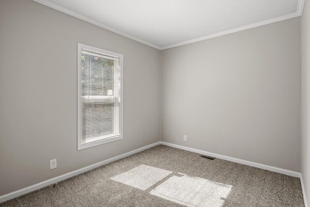 carpeted spare room with ornamental molding