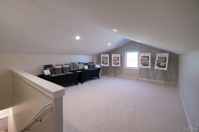 office space featuring light carpet and lofted ceiling