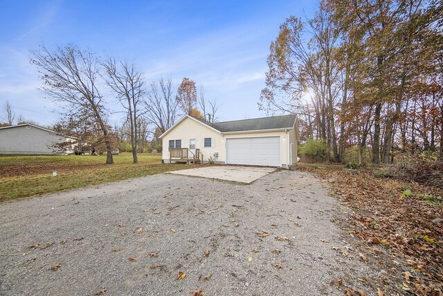 10376 Glencoe Rd, Jerome, MI 49249 - view of home's exterior with asphalt driveway and a garage