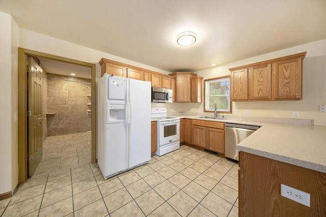 10376 Glencoe Rd, Jerome, MI 49249 - kitchen featuring stainless steel appliances, a sink, light tile patterned floors, and light countertops