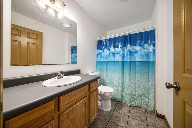 10376 Glencoe Rd, Jerome, MI 49249 - bathroom featuring toilet, vanity, tile patterned flooring, and a shower with curtain