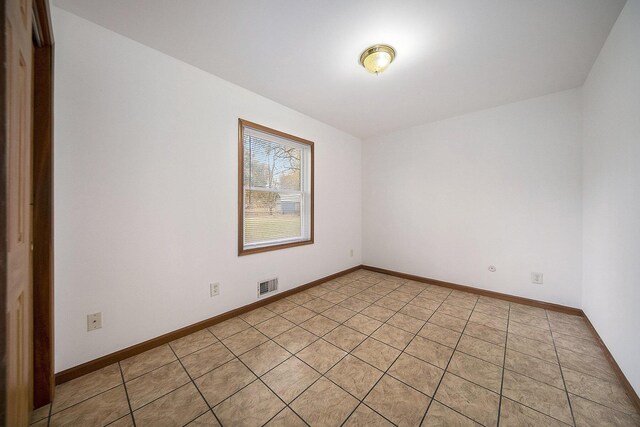10376 Glencoe Rd, Jerome, MI 49249 - spare room with baseboards and light tile patterned floors