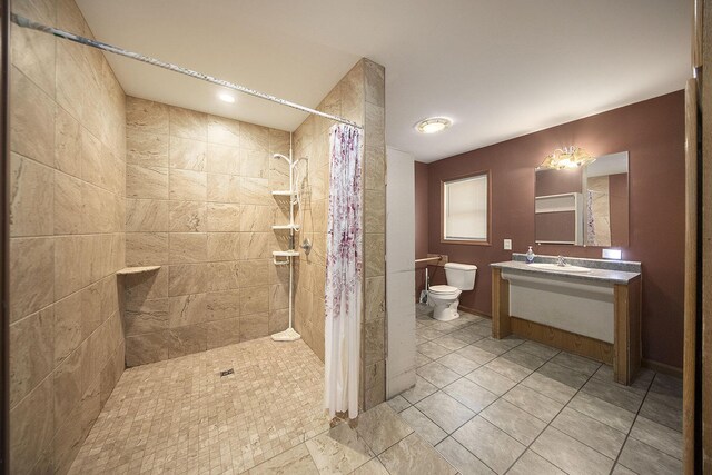 10376 Glencoe Rd, Jerome, MI 49249 - full bath with toilet, tiled shower, vanity, and tile patterned flooring