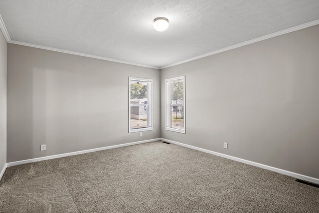 carpeted spare room with a textured ceiling and ornamental molding