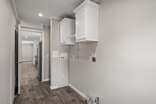 clothes washing area with cabinets, washer hookup, electric dryer hookup, dark hardwood / wood-style flooring, and ornamental molding