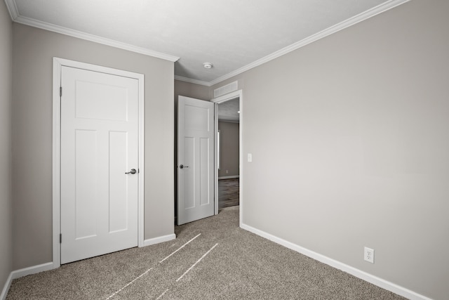 unfurnished bedroom featuring carpet floors and ornamental molding