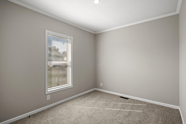 unfurnished room featuring carpet flooring and crown molding