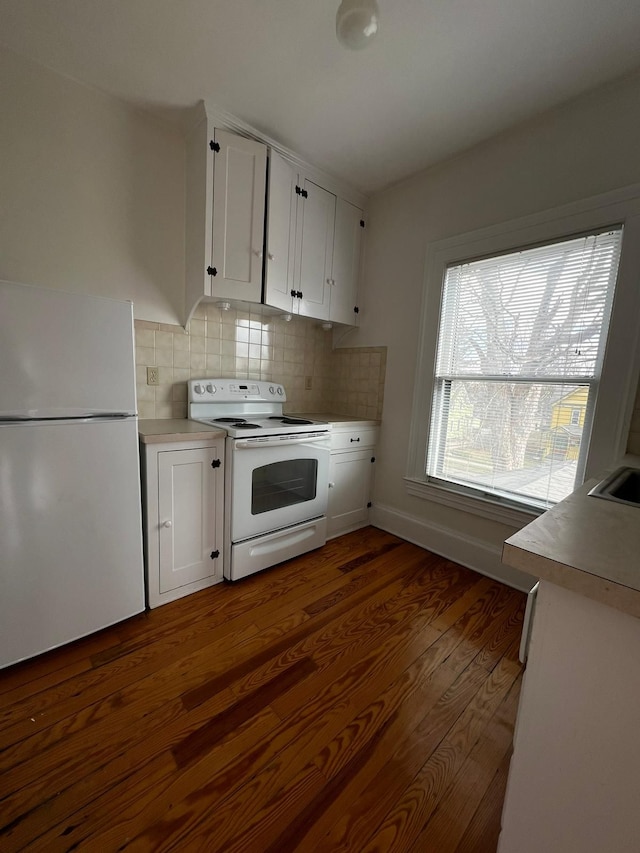 kitchen featuring white appliances, tasteful backsplash, white cabinetry, and dark wood-type flooring