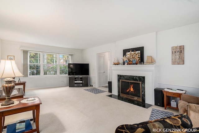 4102 Highgate Rd, Norton Shores, MI 49441 - carpeted living area featuring a high end fireplace