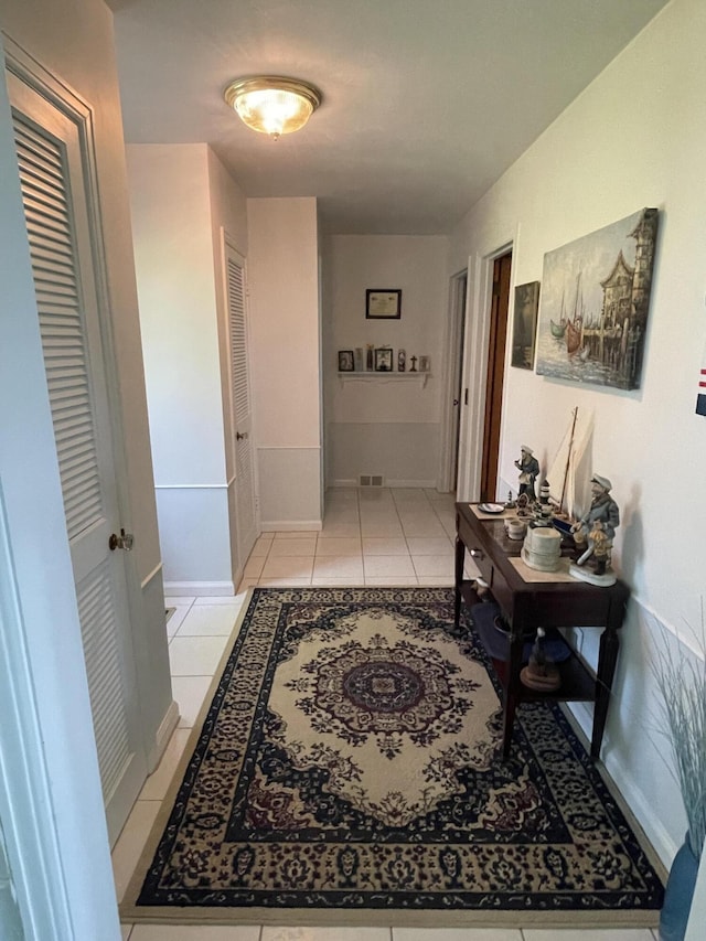 4102 Highgate Rd, Norton Shores, MI 49441 - corridor featuring light tile patterned flooring, baseboards, and visible vents