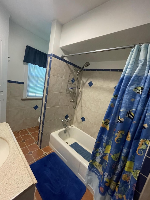4102 Highgate Rd, Norton Shores, MI 49441 - full bathroom with tile walls, shower / bath combo with shower curtain, tile patterned flooring, and vanity