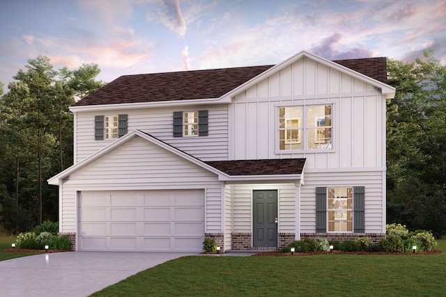 view of front of house with a lawn and a garage