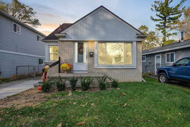 view of front of home with a lawn