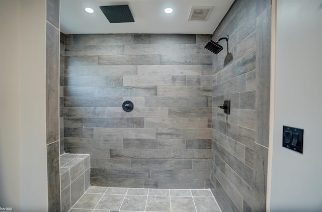 bathroom with a tile shower