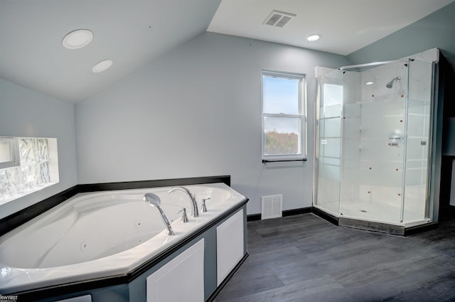 bathroom with plus walk in shower and vaulted ceiling