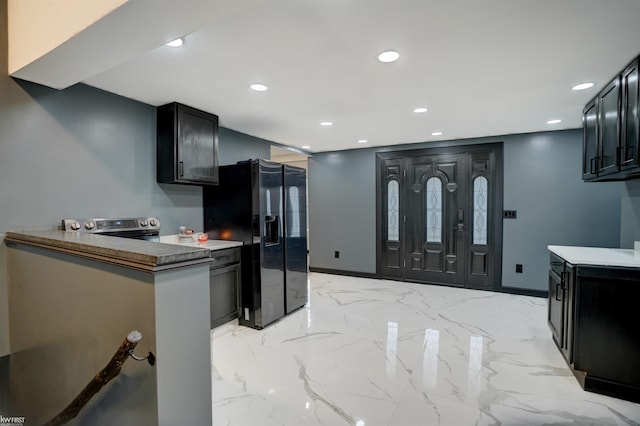 kitchen with black fridge with ice dispenser and kitchen peninsula