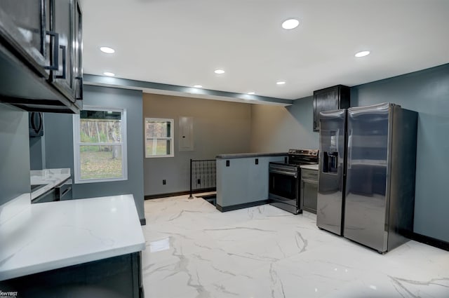 kitchen featuring light stone counters, kitchen peninsula, stainless steel appliances, and electric panel