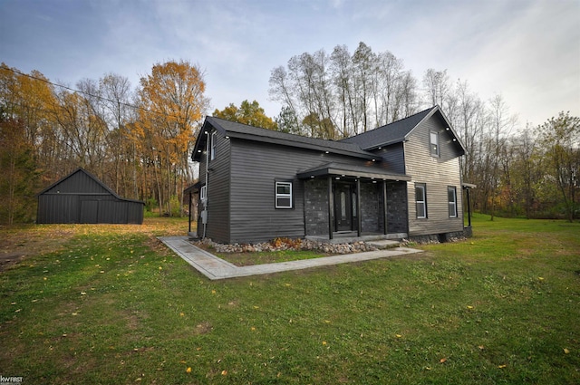 rear view of house featuring a yard