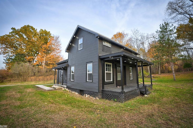 view of property exterior featuring a porch and a yard