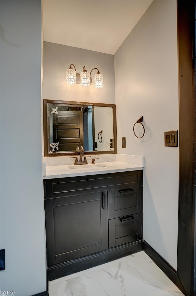 bathroom with vanity and lofted ceiling