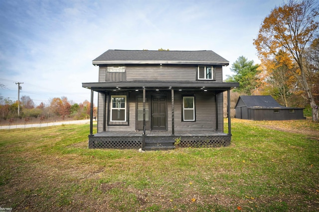 view of front facade with covered porch and a front yard