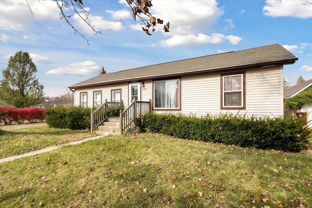 single story home with a front lawn