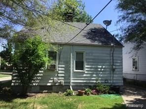 view of side of property with a yard