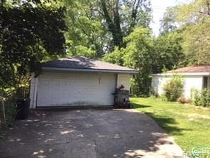 garage featuring a yard