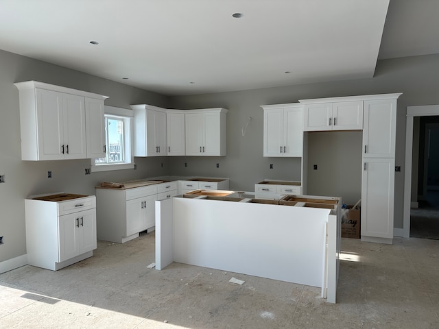 kitchen featuring white cabinetry and a center island