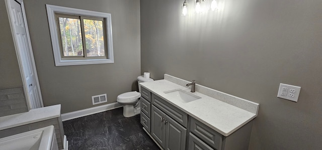 bathroom featuring vanity and toilet