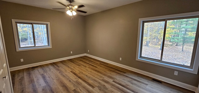 unfurnished room featuring ceiling fan and light wood-type flooring