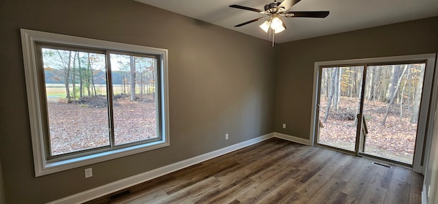 unfurnished room with ceiling fan and hardwood / wood-style floors