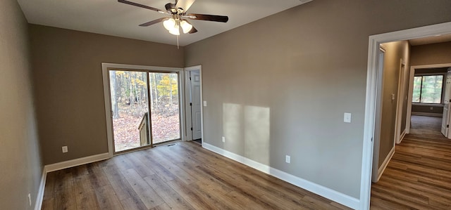 unfurnished room featuring ceiling fan, a healthy amount of sunlight, and light wood-type flooring