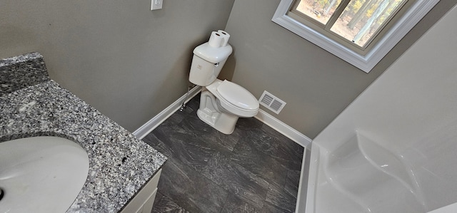 bathroom featuring vanity and toilet