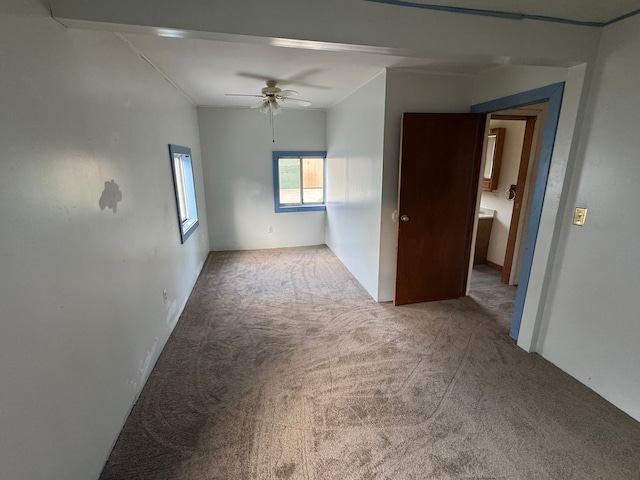 carpeted empty room with ceiling fan