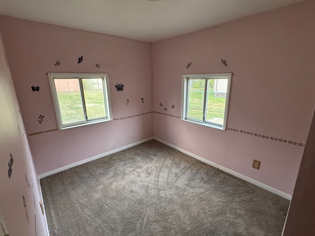 carpeted spare room with plenty of natural light