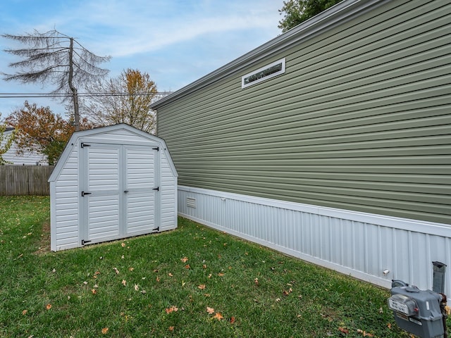 view of outbuilding with a lawn