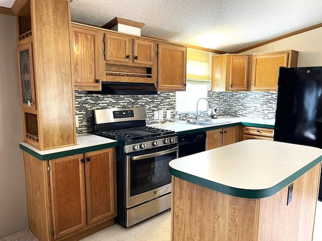 kitchen with sink, a center island, a textured ceiling, decorative backsplash, and black appliances