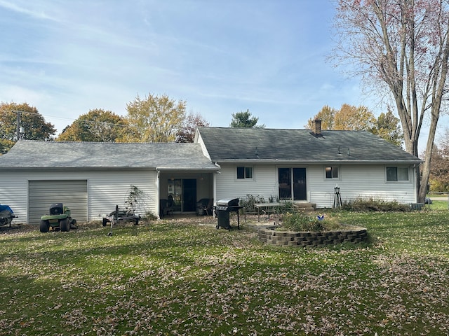 back of property featuring a yard