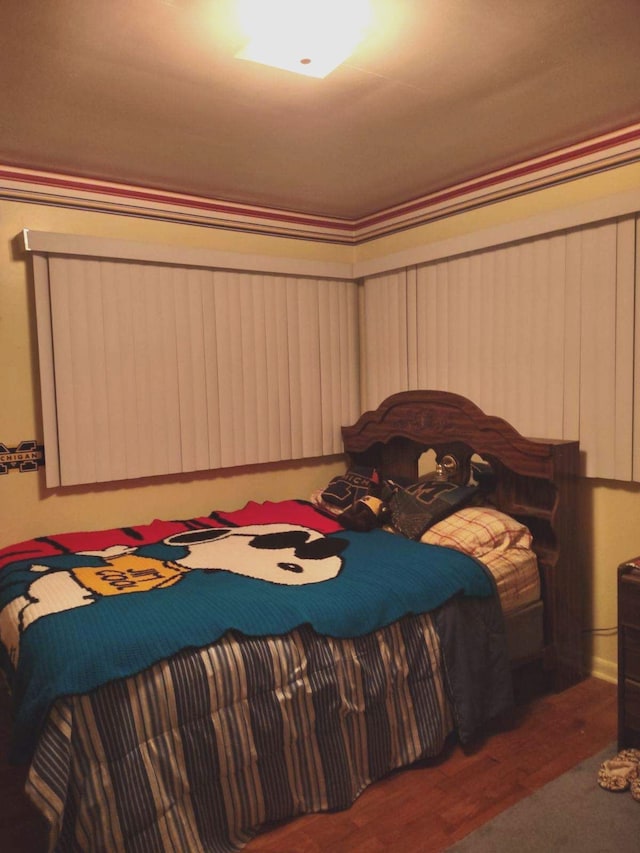 bedroom featuring dark hardwood / wood-style flooring