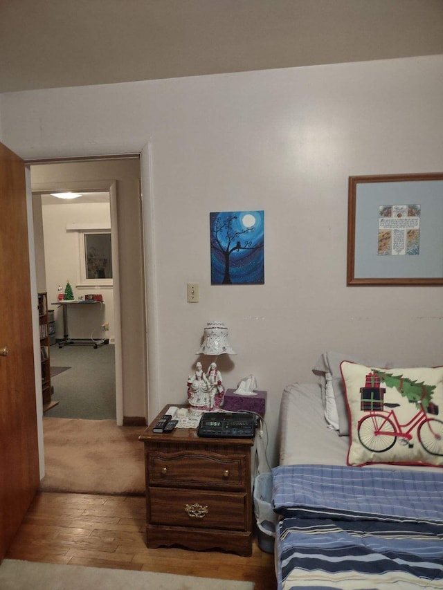 bedroom with light hardwood / wood-style floors