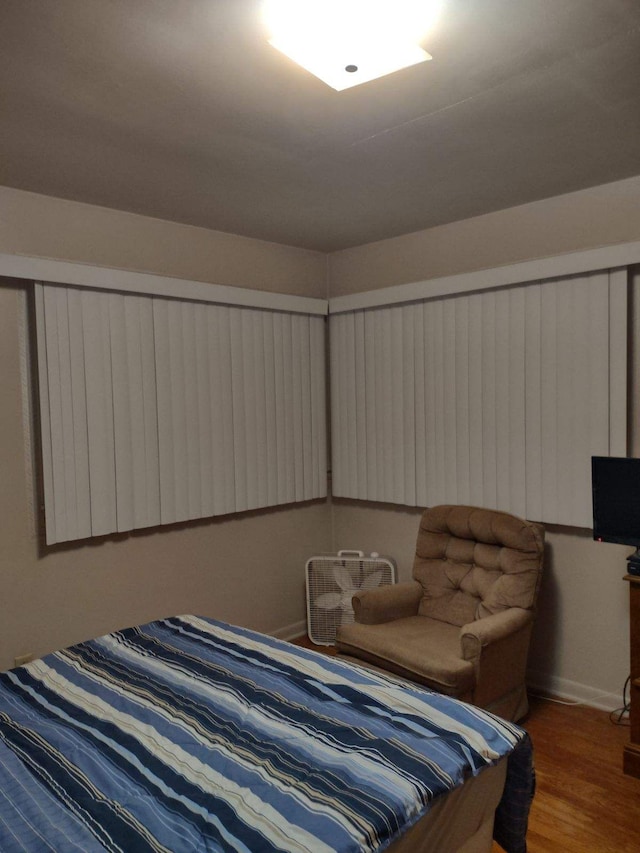 bedroom with wood-type flooring